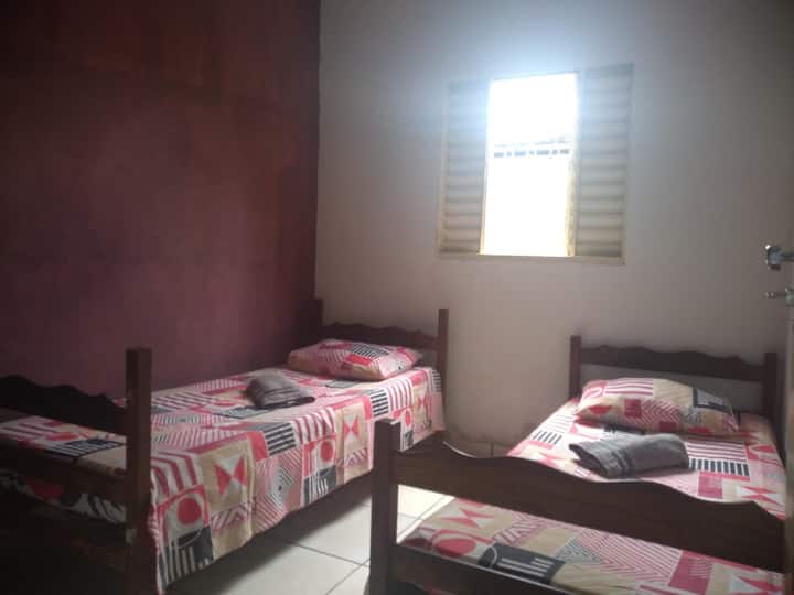 Single bedroom with two beds that turns into a bunk bed.