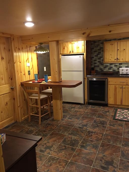 A cozy eating area for two, with plenty of space to set up the available card table for additional seating.