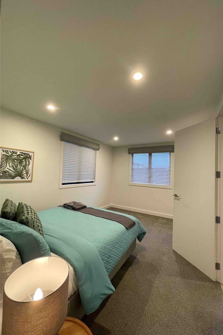 Downstairs bedroom with walk-in wardrobe and full length mirror