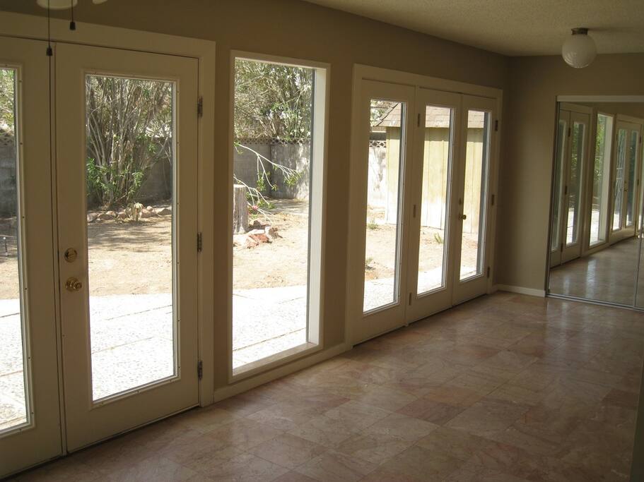 French glass doors in the back of the house over looking the back yard