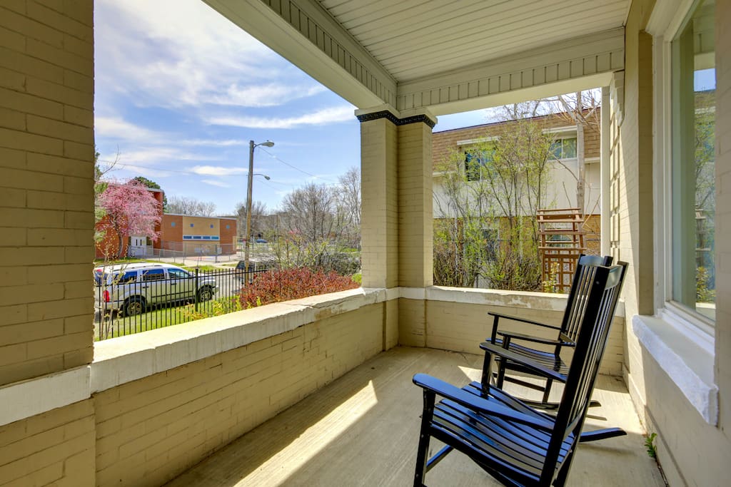 Spacious front porch with comfortable rocking chairs to enjoy lovely outdoor weather