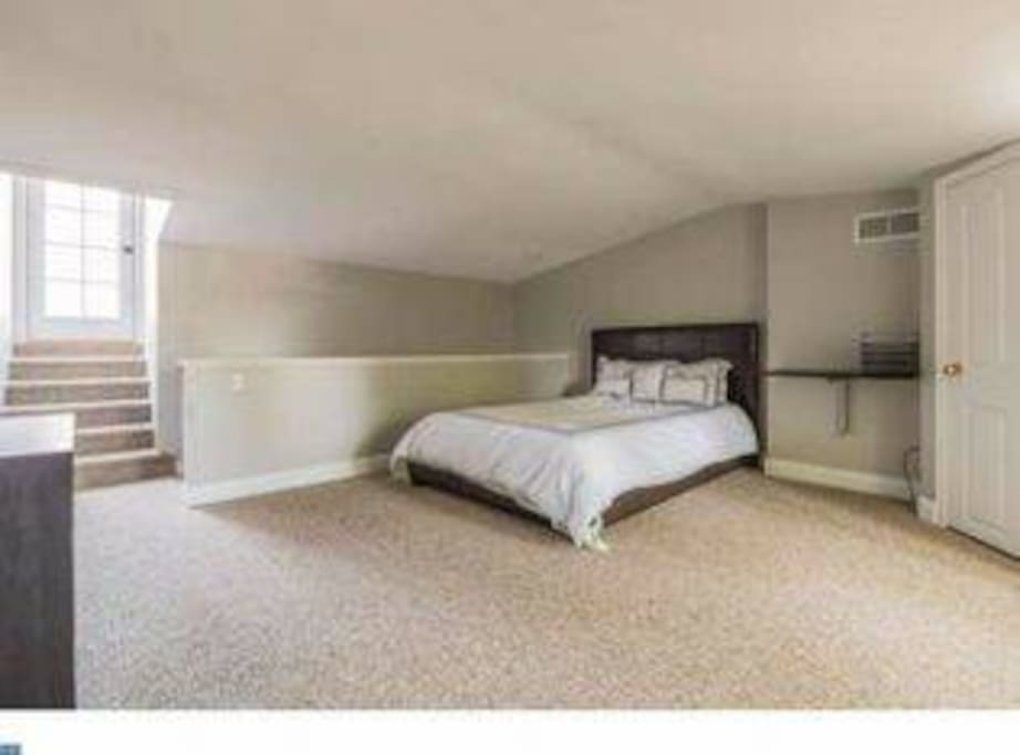 Large, private bedroom on 3rd floor with queen bed & private access to rooftop deck