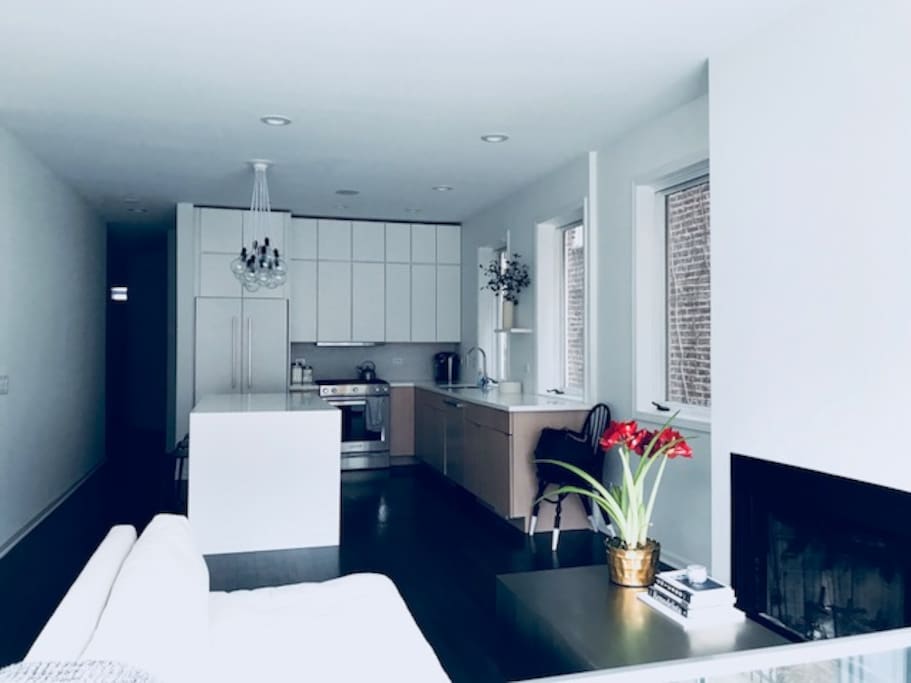 Living area (with a wood-burning fireplace) off the kitchen