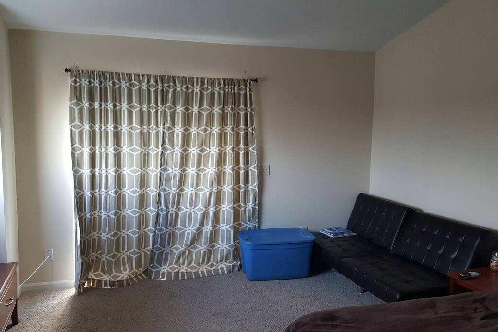 Queen size bed and extra couch to watch large 46 inch flat screen tv
