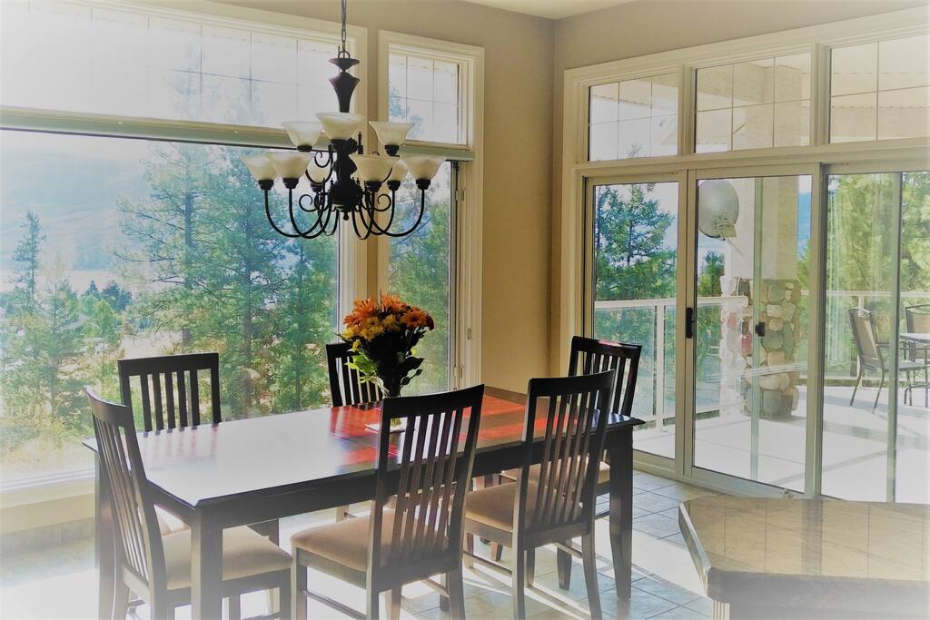 Enjoy dining inside with a view of Okanagan Lake.