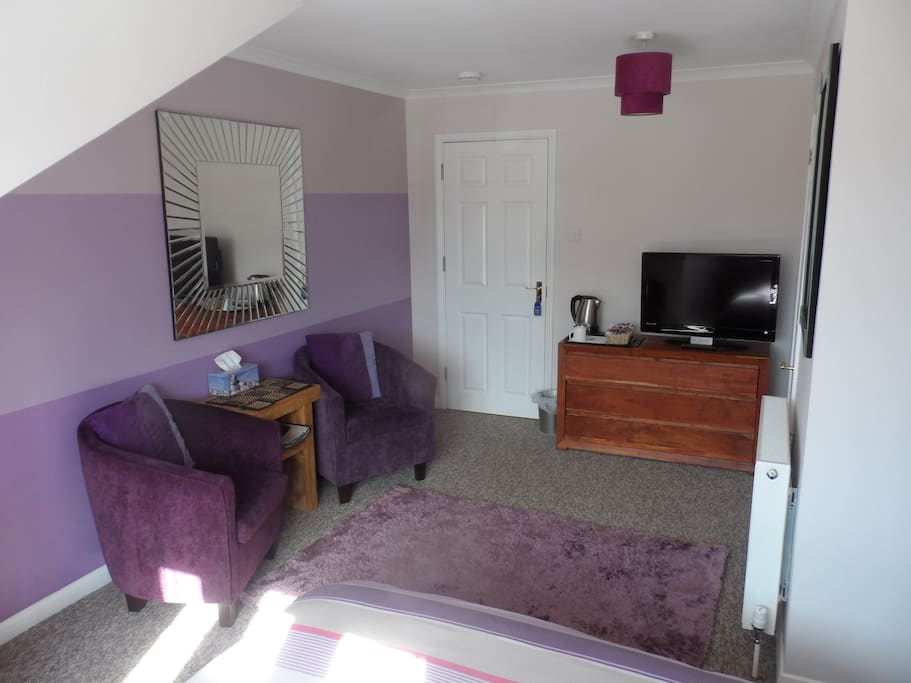 2 tub chairs, 32" flat screen TV coffee and tea making facilities