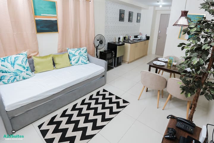 The Living Room - With a huge comfortable pull-out sofa bed, one can easily relax with friends and or family in this Taal View Bedroom Suite! Complete with PS3 w/ lots of games, Music Streaming, Video Streaming, you will surely enjoy your stay here!