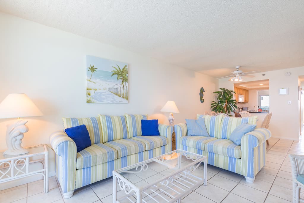 When you're ready to relax indoors, you'll enjoy the bright living room that overlooks the beach