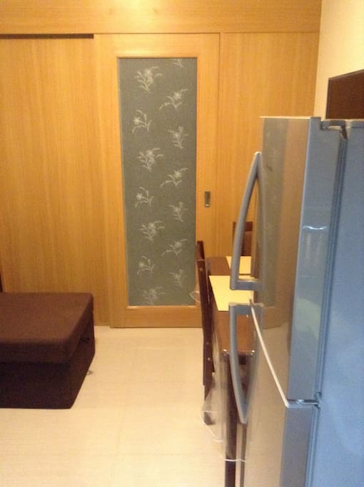 Bedroom door with privacy window covering.