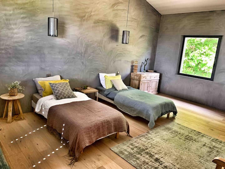 Last first floor room of the principal house, with 2 singles bed of a king size bed 