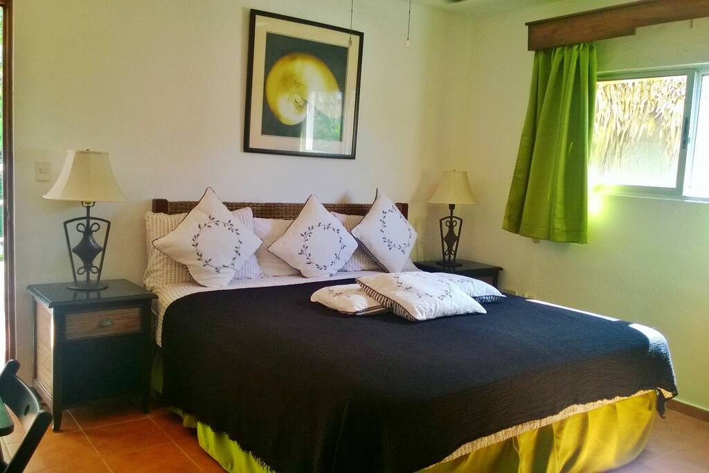 First bedroom has A/C and a comfortable King size bed (76 in×80 in, 193 cm × 203 cm), 32 inch TV, small fridge, small table, microwave. A big closet in the back and a door that connects to the living room