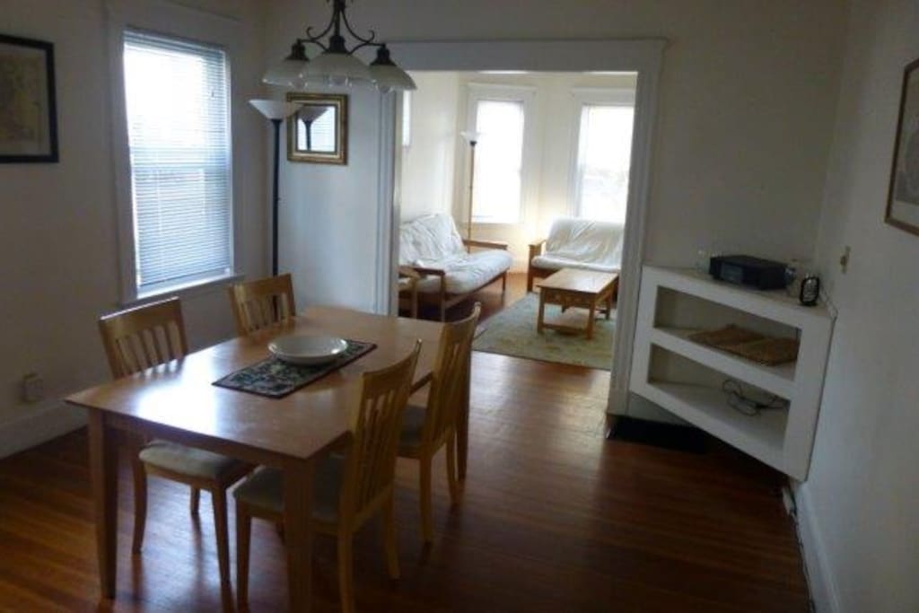 Walk through connected dining room and lounge room. Table sits 6. Can be extened to sit 8, we can lend our guests a couple of chairs from our seperate apartment upstairs!