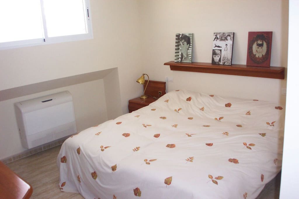 Dormitorio de matrimonio con 2 camas de 90 eléctricas articuladas
