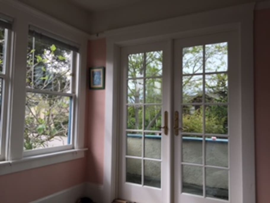 This is the second bedroom upstairs which also gets good light and looks out on a fig tree from the windows and has a balcony.