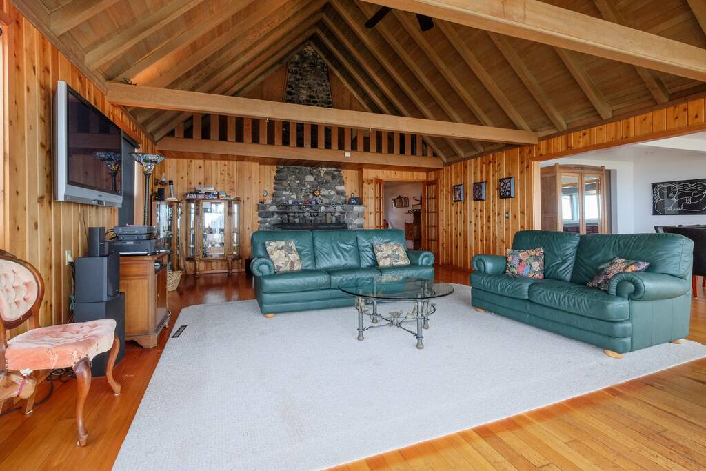Spacious living room with floor to ceiling real rock and agate fireplace