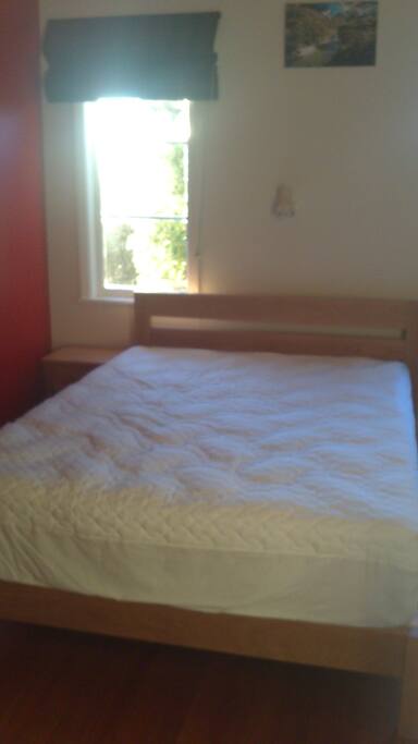 Wooden floors, blackout curtains, queen-sized bed, bedside tables, desk and drawers, Wifi access