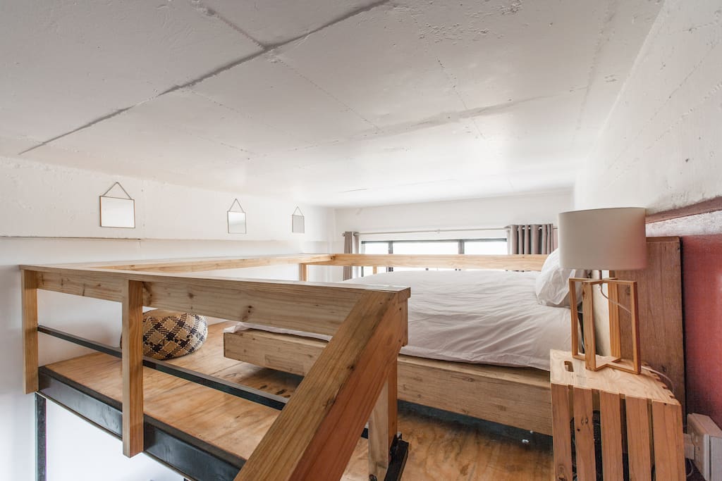 The main sleeping area. A mezzanine with an extra-king bed for our tall guests!