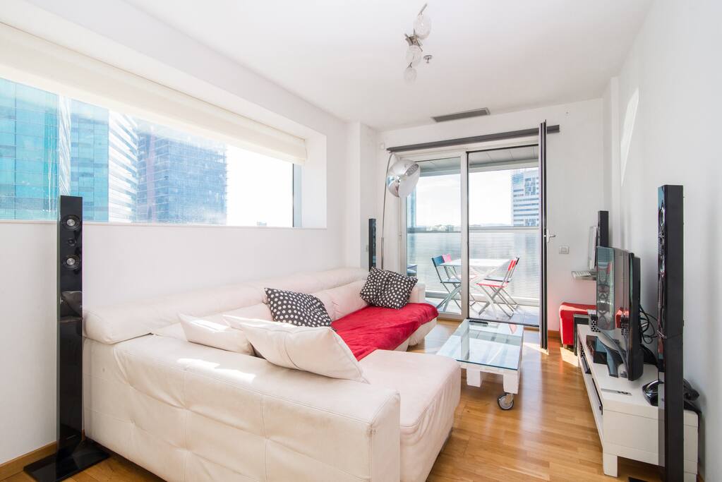 Living room, you can see the 4 seater table in the balcony.