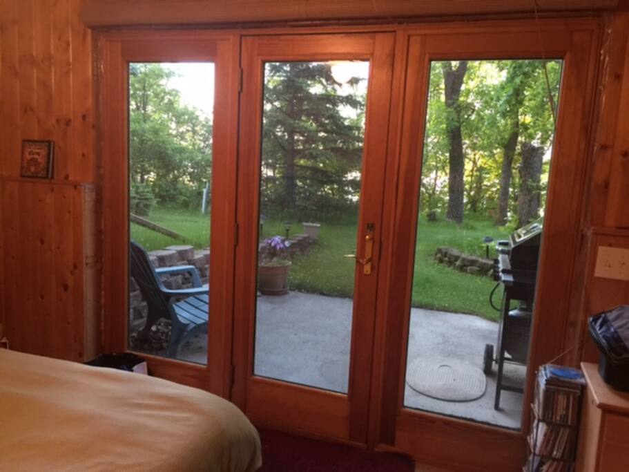 Bedroom and patio to the lake.