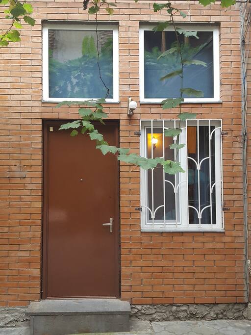 This is our front door, there is a lovely canopy of grape vines growing overhead.