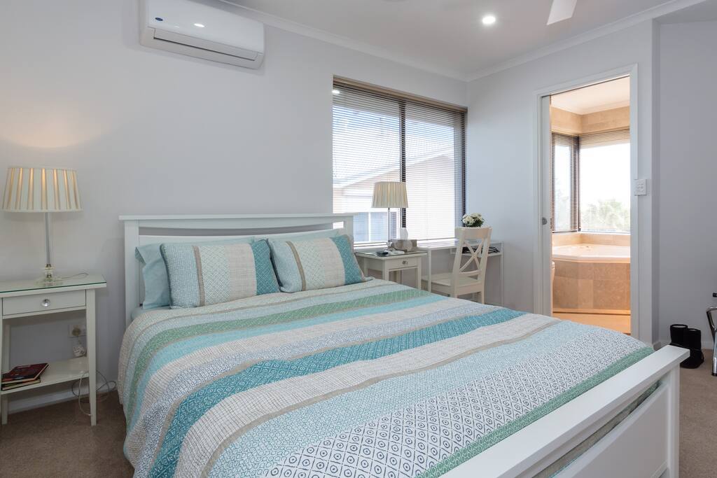 Queensize bed in Spa room