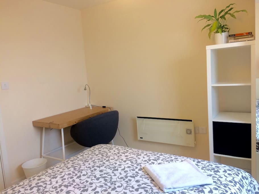 Laptop friendly workspace in the guest room.
