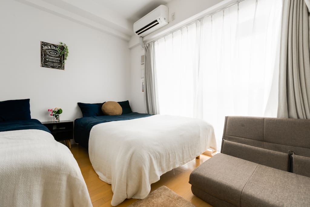 Two semi double beds and sofa type bed