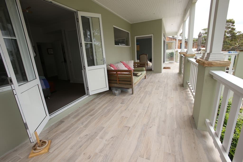 The wide deck winds around the house & enjoys elevated district views