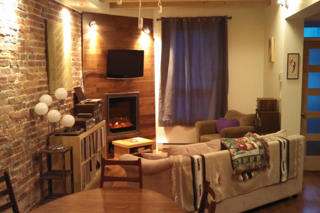 cozy living room with indoor fireplace (not real, but cute lights)
