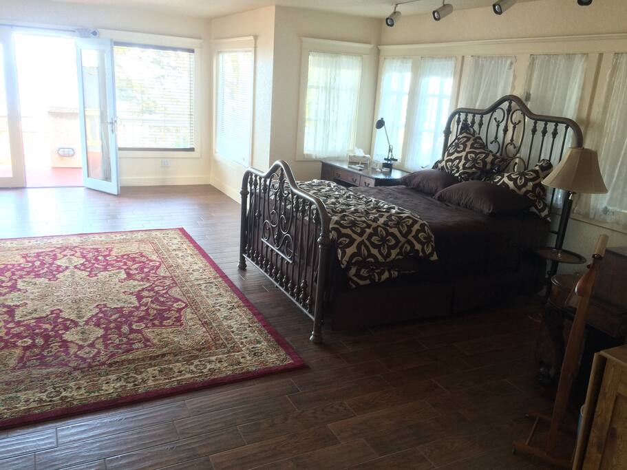 Queen size bed, and lots of window space.refrigerator