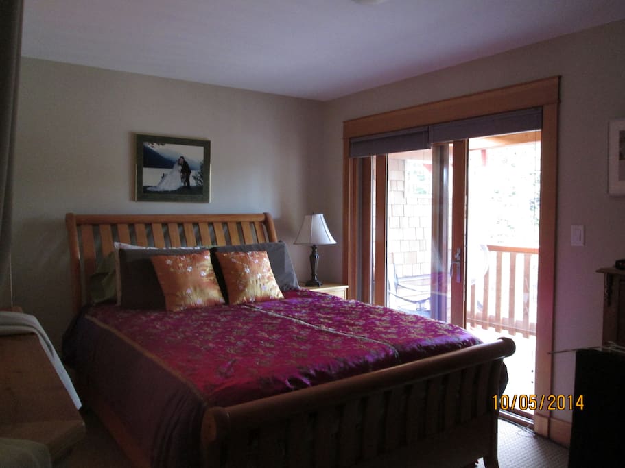 Loft bedroom with private deck and peek-a-boo blinds.