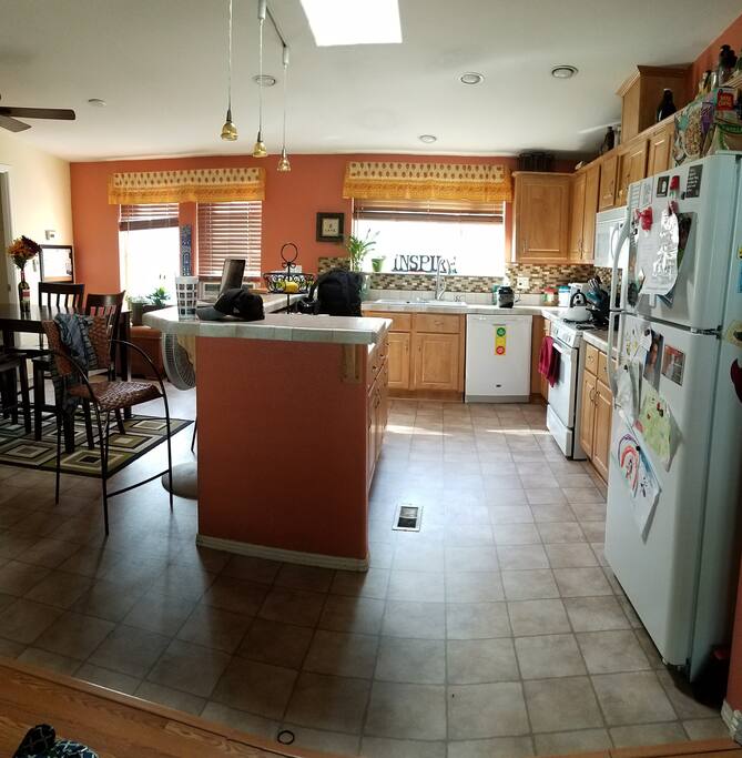 Kitchen and dining area. Though we won't necessarily promise breakfast, there is plenty of coffee and tea and you're welcome to cook anything you'd like to at anytime.