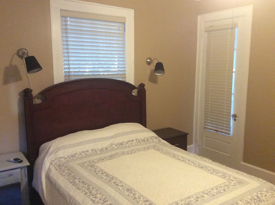 Rear bedroom with French door opening to the back porch