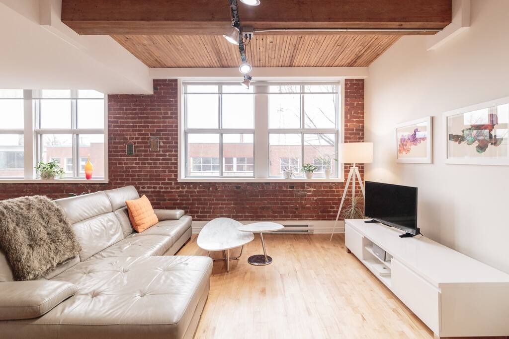 Open space living room with high ceilings and loads of light.