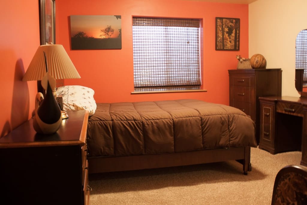 Modern egress window with bamboo blinds, Each guest is provided with two comfortable pillows.