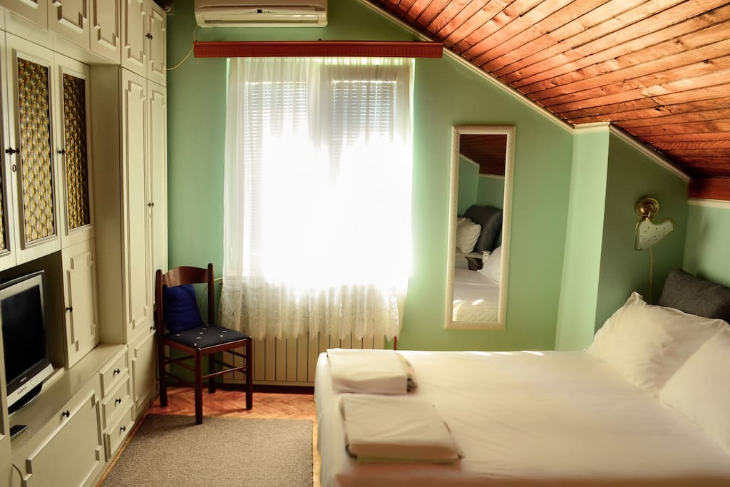 Room 1. Two double beds for up to 4 persons: cable TV, air-conditioning and heating. All rooms have a big dedicated fridge in the corridor of the house floor.