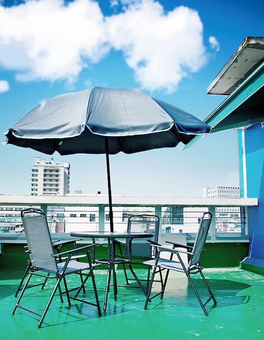 There is a seating area on the rooftop.