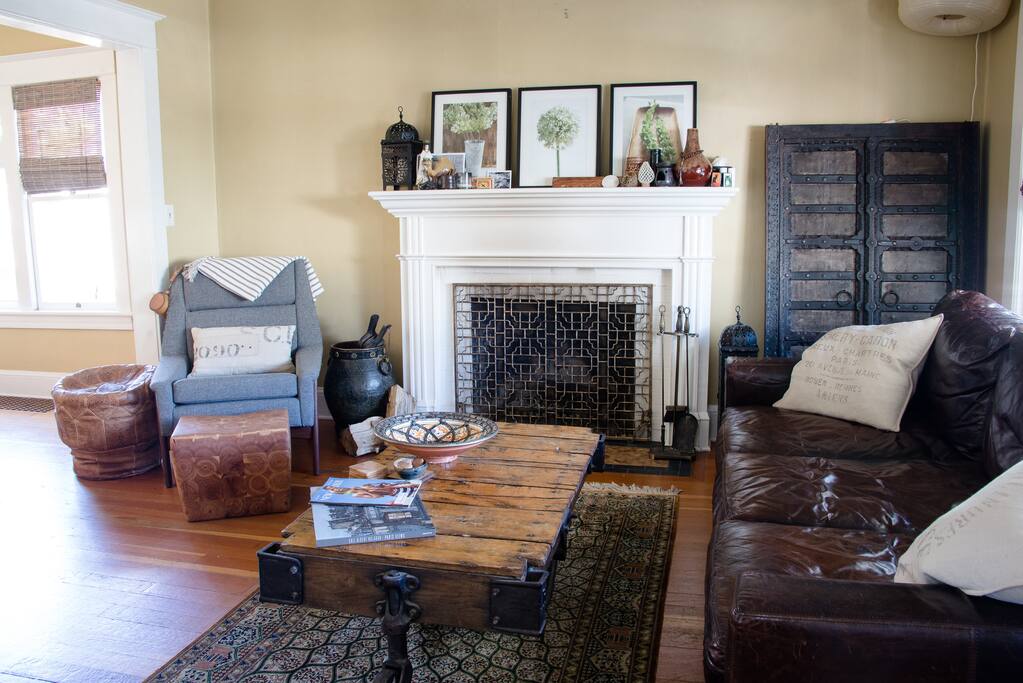Living room with wood burning fireplace.