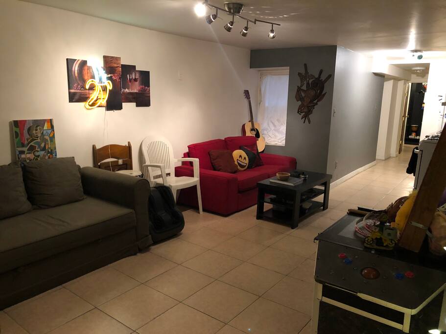 Living room with pacman machine, 47" TV, LG Speakers, Record player