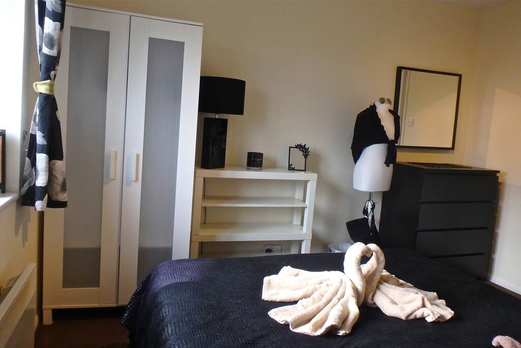 Beautiful bedroom with double bed, wardrobe, bedside tables and draws
