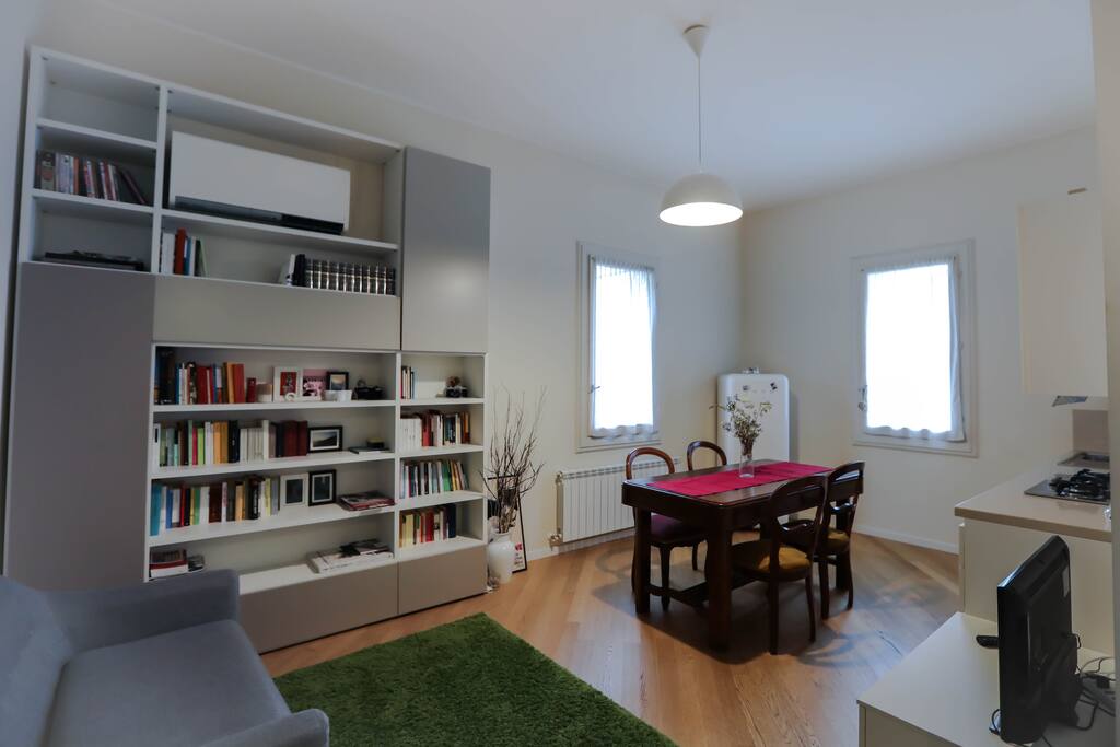 Dining rooms , library , table, television.