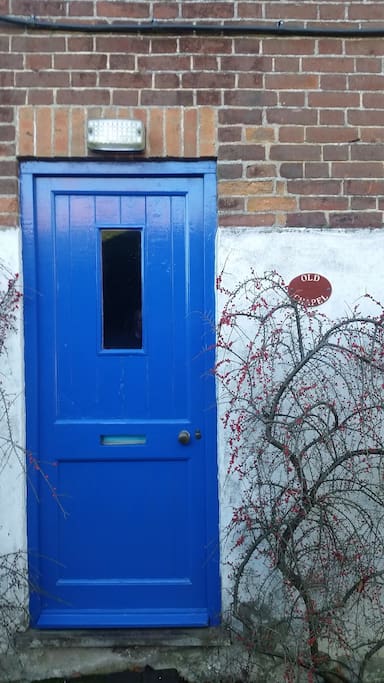 The blue front door with Old Chapel sign