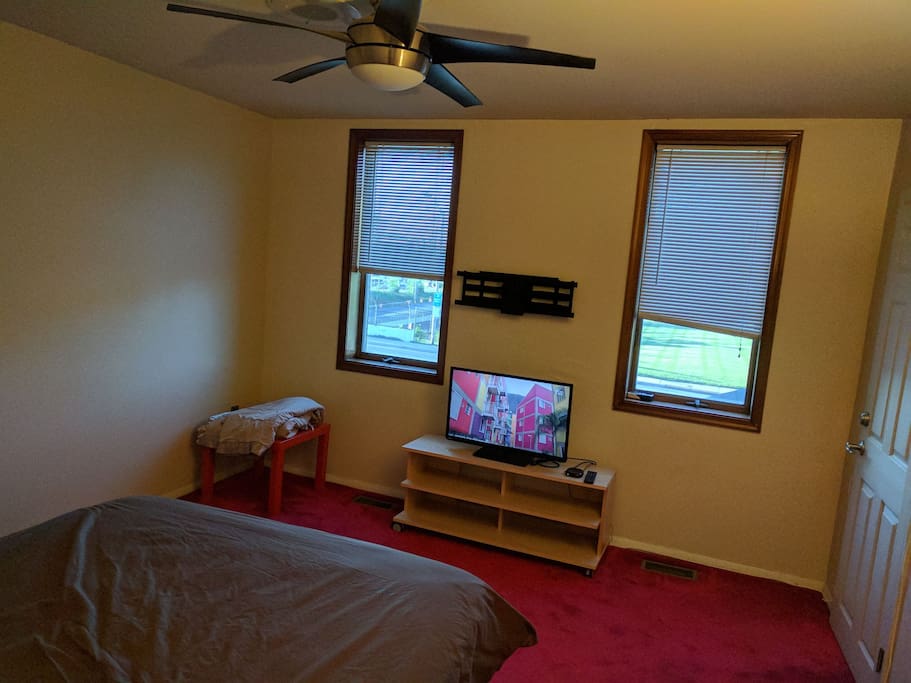 Master bedroom with closet, 32" TV, Roku device. Xtra large overhead fan.