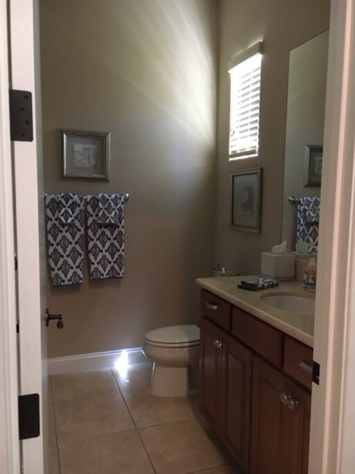 Full bath with walk-in closet