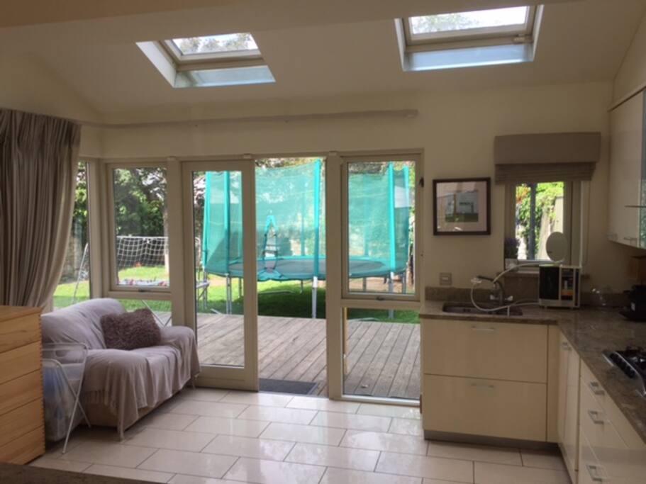Rear facing part of kitchen with double doors to garden