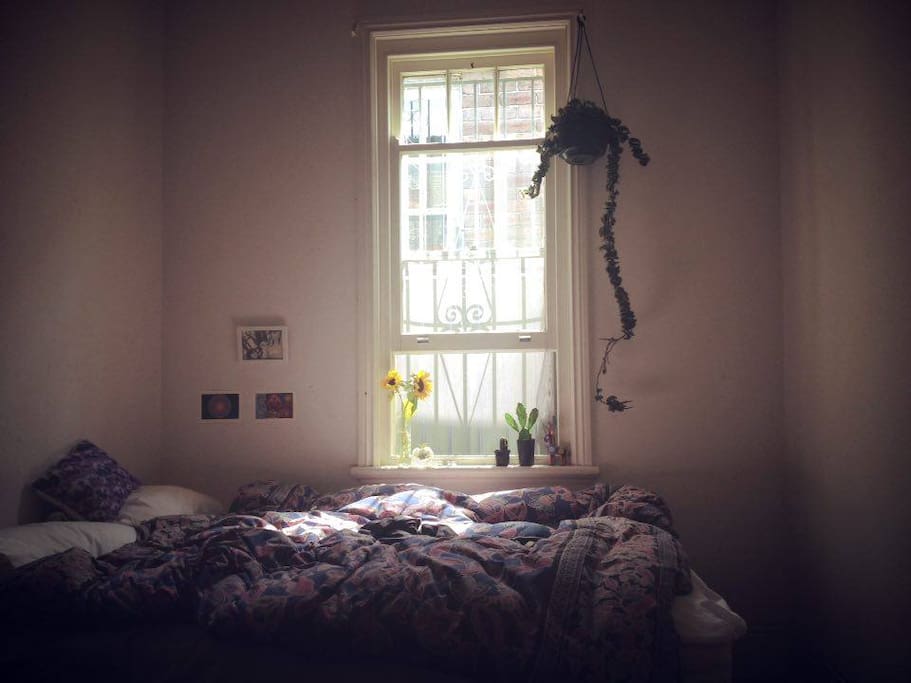 Bedroom with window and double bed