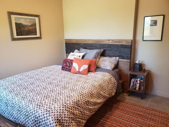 Queen Bedroom with blackout shades.