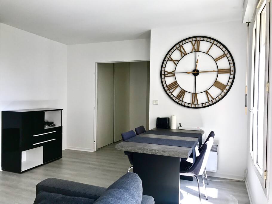 Living room with a 4 people table.
