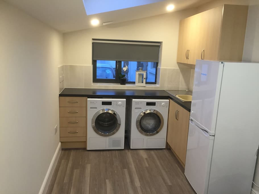 Kitchenette includes laundry facilities (washer and dryer), induction hob and fridge freezer