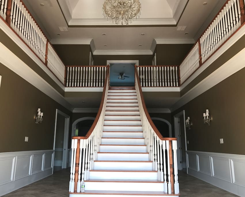 Breathtaking staircase in large foyer